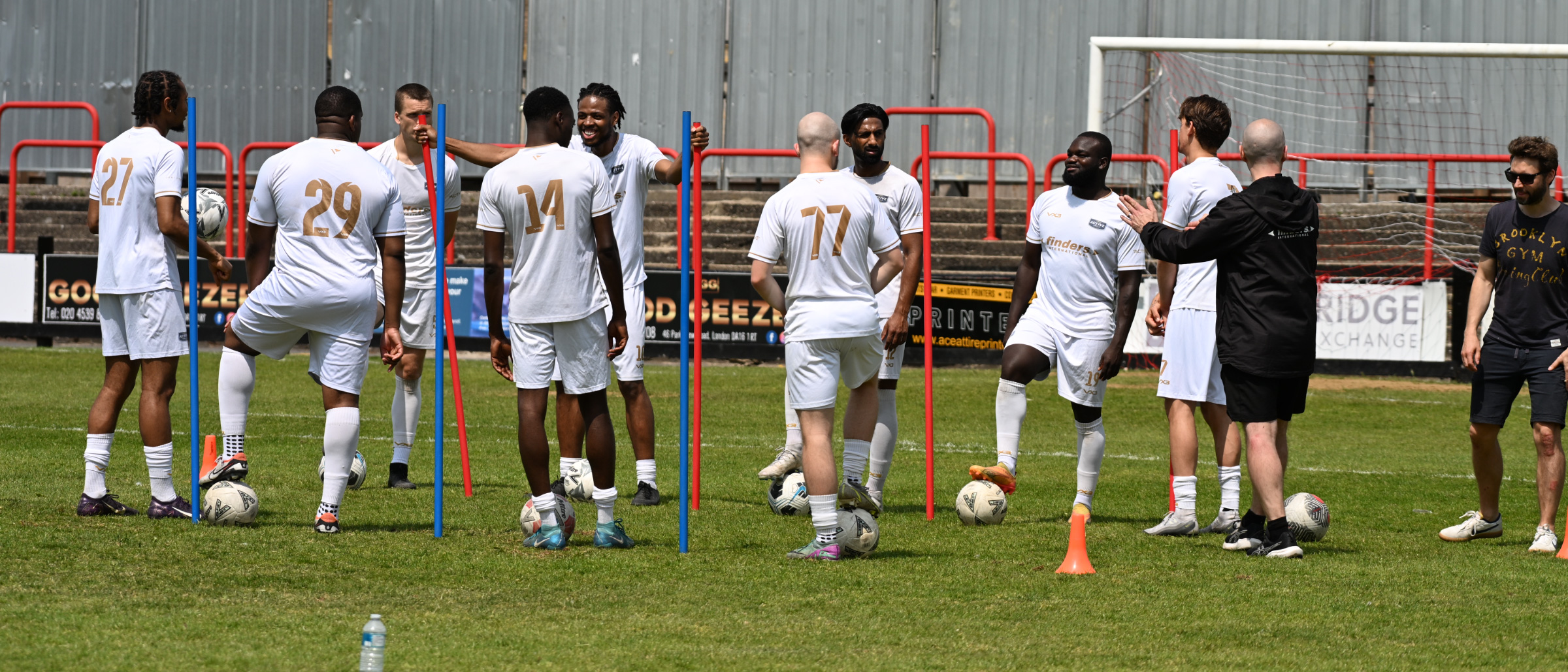 Active Sports FC players warming up with the ball during a first-team training session.